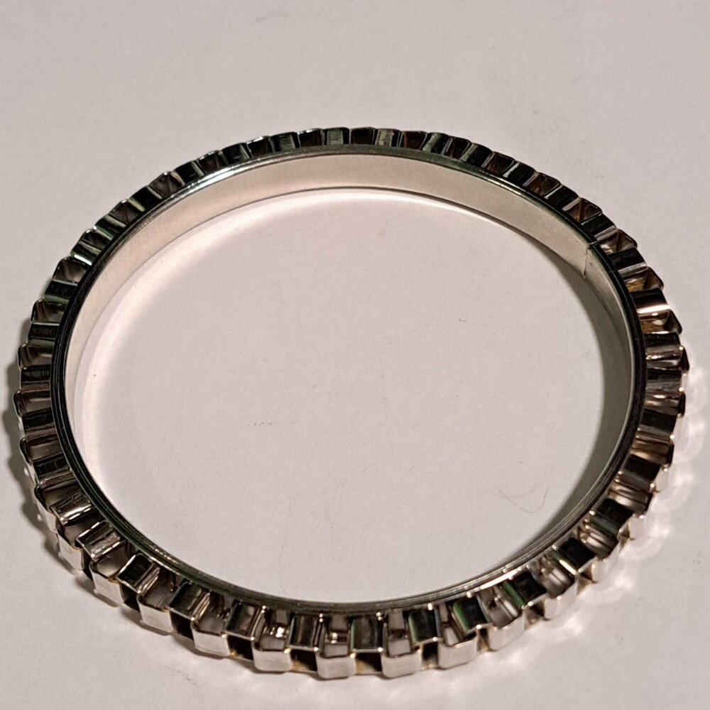 silver chrome color bracelet with a folded loop design